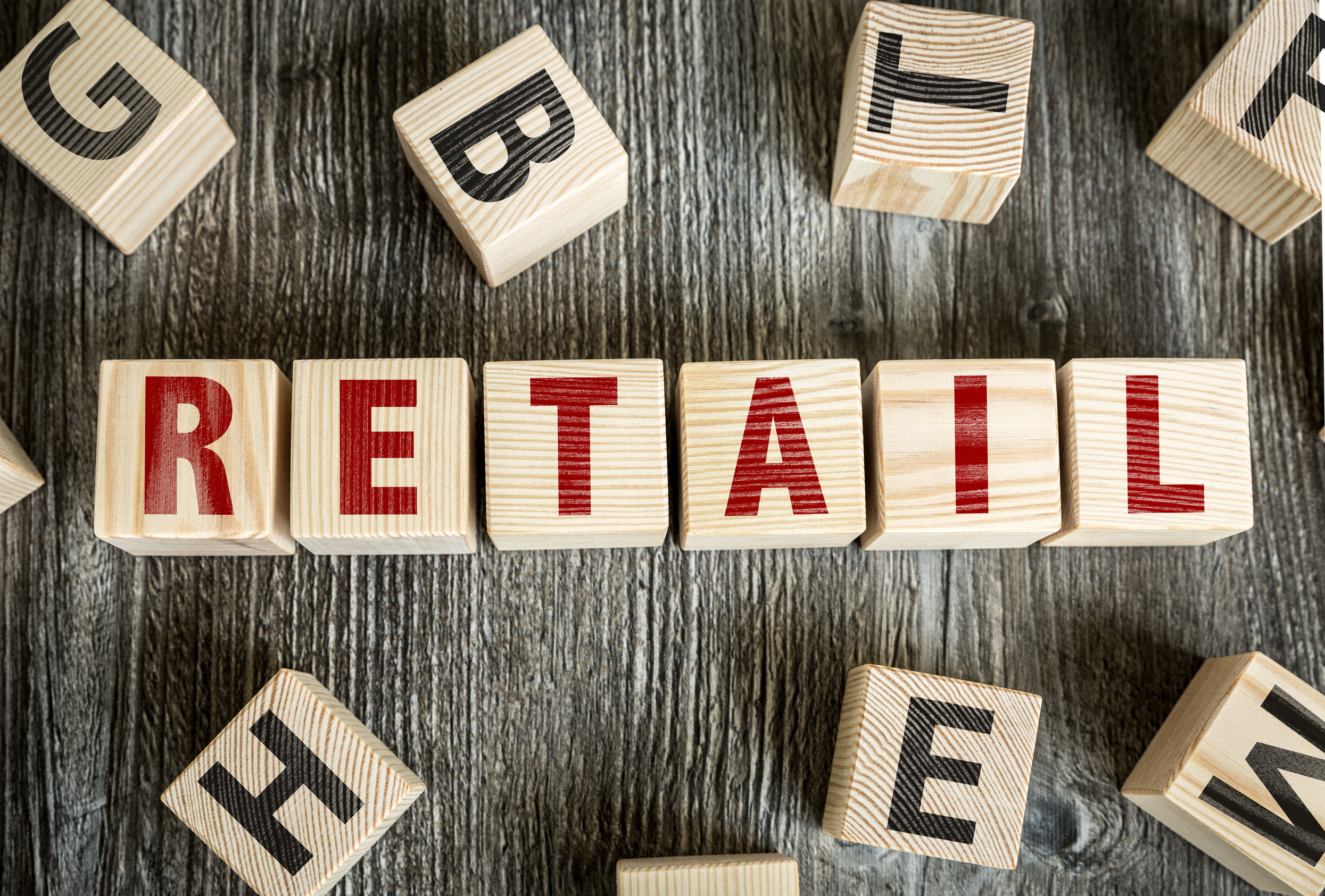 Retail written on a wooden cube background