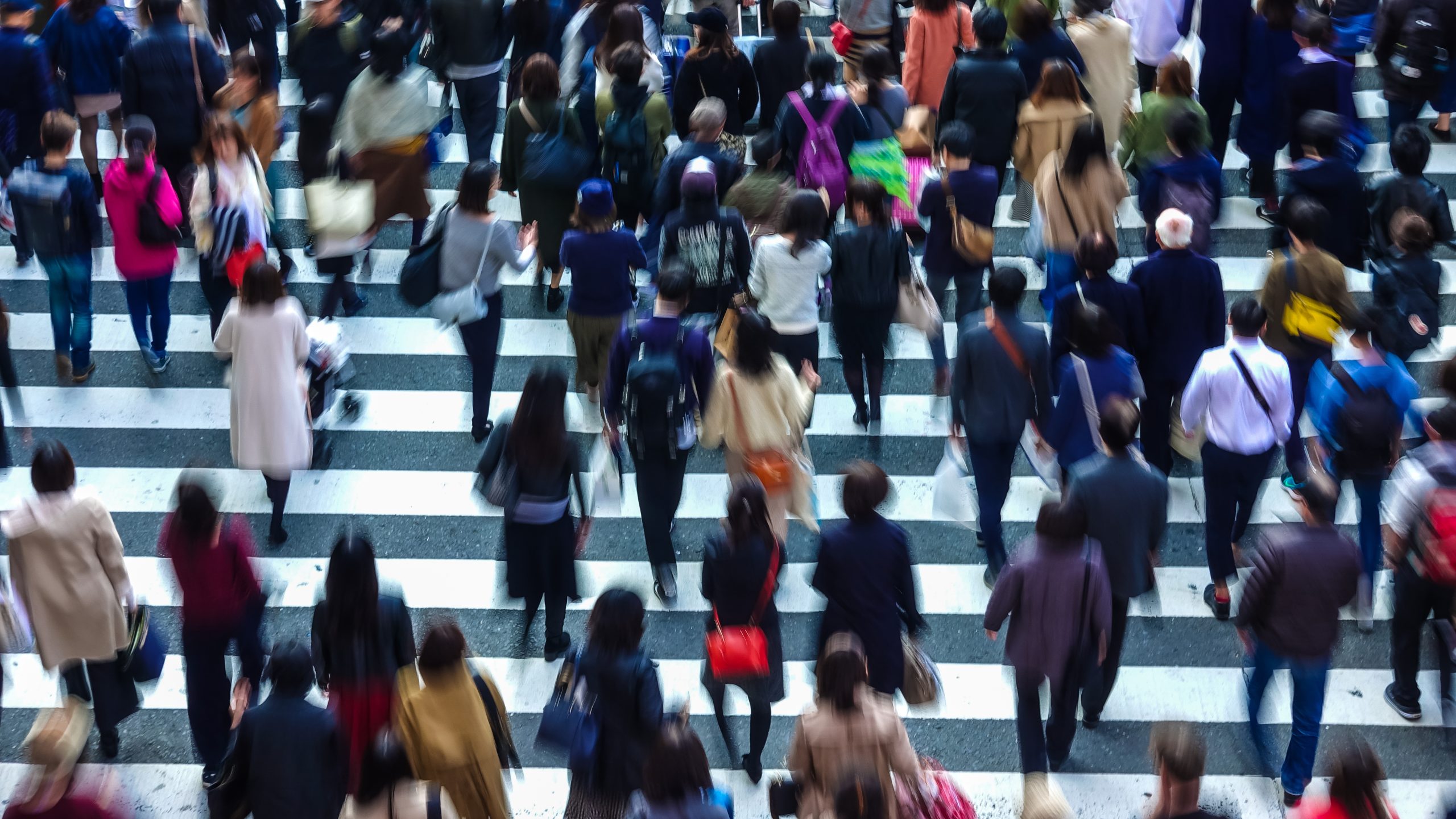 Asian People are across the crosswalk