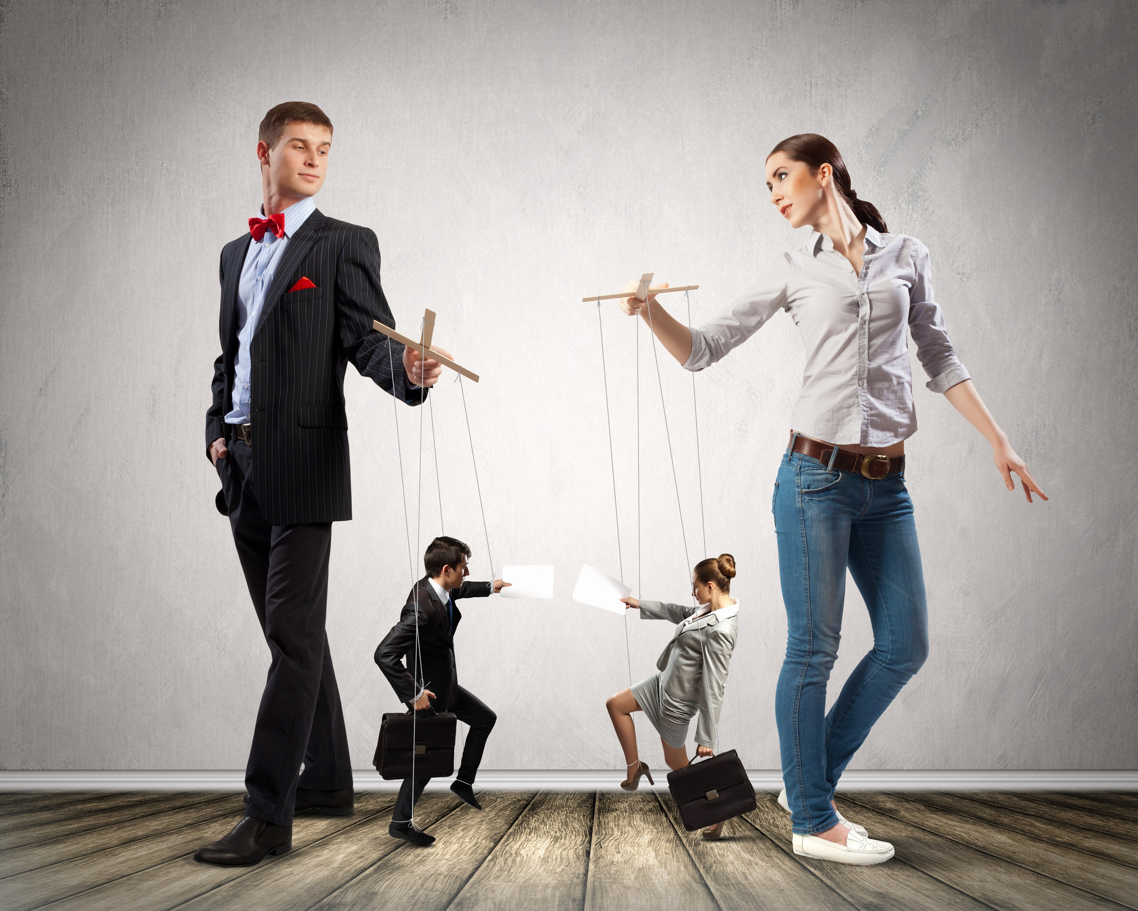 Image of man and woman with marionette puppets